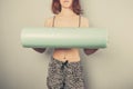 Athletic young woman with foam roller Royalty Free Stock Photo