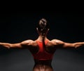 Athletic young woman showing muscles of the back Royalty Free Stock Photo