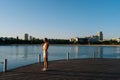 Athletic young woman in sportswear exercising and stretching muscular for warming up before running or working out by