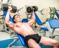 Athletically built sportsman in the gym Royalty Free Stock Photo