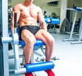 Athletically built sportsman in the gym Royalty Free Stock Photo