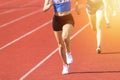 Athletics people running on the track field. Sunny day Royalty Free Stock Photo
