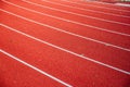 Athletics stadium running track red lines marks. Royalty Free Stock Photo