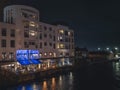 Athlone, Ireland - 04.11.2022: Bacchus Restaurant by river Shannon illuminated at night. Eat out concept. Night life