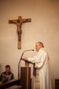 Atholic Priest On Altar Praying During Mass