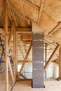 Atiic with environmentally friendly and energy efficient thermal insulation rockwool. Wooden Roof Frame House Construction. Royalty Free Stock Photo