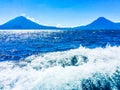 Atitlan, Toliman & San Pedro volcanoes viewed from boat on Lake Atitlan, Guatemala Royalty Free Stock Photo