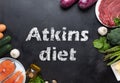 Atkins Diet food ingredients on balck chalkboard, health concept, top view with copy space. Concept with text