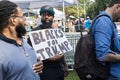 African American man holds sign supporting Trump outside Atlanta jail