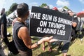 Female holds anti-Trump sign outside Fulton County Jail