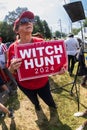 A Trump supporter holds Witch Hunt 2024 sign outside Fulton County Jail