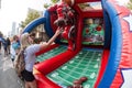 Woman Throws Footballs Toward Targets At College Football Fan Fest