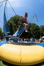 Girl Gets Airborne Bouncing On Bungee Trampoline At Atlanta Festival