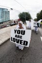 Woman Carries Sign Reading You Are Loved In Transgender Parade