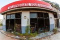 Ironic Sign Sits Above Burned Out And Vandalized Small Business