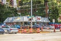 Zesto ice cream store with cars and people