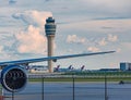 Jet Engine and Control Tower Royalty Free Stock Photo