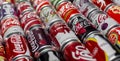 Atlanta, Georgia, USA April 4, 2020: background of many multicolored aluminum cans of Coca Cola selective focus