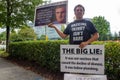 ATLANTA, UNITED STATES - Sep 25, 2020: An anti-vaccine protester stands outside of the CDC headquarters in Atlanta, Georgia with Royalty Free Stock Photo