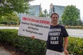 ATLANTA, UNITED STATES - Sep 25, 2020: An anti-vaccine protester stands outside of the CDC headquarters in Atlanta, Georgia with