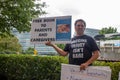 ATLANTA, UNITED STATES - Sep 25, 2020: An anti-vaccine protester stands outside of the CDC headquarters in Atlanta, Georgia with