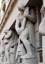 Atlantes sculptures adorning the portal of the 1930s landmark building, Lodz, Poland