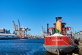 Atlantic Basin, Red Hook, NY showing the stern of an old oil tanker, gantry cranes and the skyline of Lower Manhattan Royalty Free Stock Photo