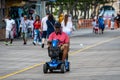 ATLANTIC CITY, NEW JERSEY - JUNE 18, 2019: Tourists walk on the 2.5 miles long boardwalk in Atlantic City