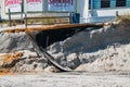 Erosion of the sand of the beach with destruction of a asphalt path in front of an Atlantic City Casino after a hurricane and