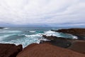 Atlantic coastVolcanic caldera.Windy an raining day with many waves. Lanzarote, Spain