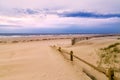 Wooden fence and sandy beach Royalty Free Stock Photo