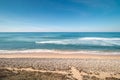 Atlantic Ocean, with its waves, has washed up on the Portuguese coast a multitude of pebbles on the sandy beach Royalty Free Stock Photo