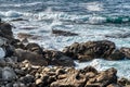 Atlantic Ocean. Pacific ocean waves crashing on rocks foaming in the water Royalty Free Stock Photo