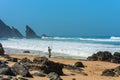 Atlantic ocean rocky coastline of Adraga beach with fisherman. Portugal Royalty Free Stock Photo