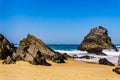 Atlantic ocean rocky coastline of Adraga beach. Portugal coast Royalty Free Stock Photo