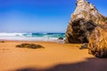 Atlantic ocean rocky and sandy beach. Adraga beach. Portugal Royalty Free Stock Photo