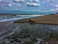 Atlantic Ocean`s waves crash over the beach at Cape Henlopen State Park, Lewes, Delaware Royalty Free Stock Photo