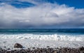 Atlantic ocean waves splashing to the stone beach of Calhau das Achadas, Madeira Royalty Free Stock Photo