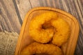 Atlantic prawns fried in batter on a wooden serving Board. Close up