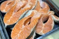 Atlantic salmon steaks from frozen raw materials on a substrate for sale in the supermarket Royalty Free Stock Photo