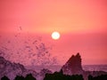 Atlantic Sunset with waves crashing onto cliffs