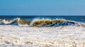 An atlantic wave breaks powerfully onto the shore