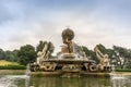 Atlas holding a globe with golden signs of zodiac famous fountain at the Castle Howard.