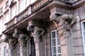 Atlas statues, decorative support elements of the balcony over the entrance of Tyszkiewicz Palace, Warsaw, Poland Royalty Free Stock Photo