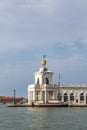 Atlas statues dogana di mare customs house at grand canal in venice italy. 17th century atlases hold globe with weathervane on top