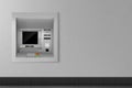Atm automated teller machine on grey wall. Banking Royalty Free Stock Photo