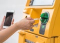 ATM Bank Auto Teller Machine with customer user person using credit card, or debit card and smartphone for paying cash payment Royalty Free Stock Photo