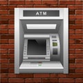 ATM Bank Cash Machine on a Brick Wall Background