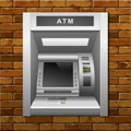 ATM Bank Cash Machine on a Brick Wall Background