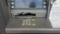 Atm cash machine broken into by thieves and forced